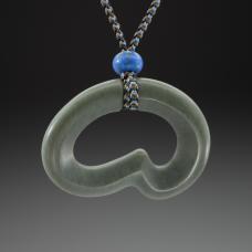 Necklace featuring a pendant I carved in sage/olive green Wyoming jade accented by lapis lazuli beads and silk kumihimo.