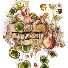 This is a hand cut 3d paper sculpture featuring floral elements and recycled honeycomb cardboard