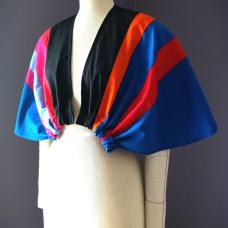 The Bolero Geometric Winged Cape embodies movement  transformation  and artistry in wearable form. Constructed from fine QUILTED cotton fabrics  each panel is precisely cut in varying colors and widths  creating a vibrant geometric interplay across the shoulders. A showcase of artisanal craftsmanship  it bridges contemporary couture with timeless artistry. 