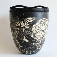 Anura is a handbuilt ceramic pot made from stoneware clay, features flowers and insects found in Maryland.