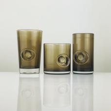 Each glass is finished by adding a bit of molten glass to create an optical lens effect  magnifying the inside. Additionally it functions as a thumbprint helping you hold the glass. This process also makes each one truly unique  adding a handmade touch to a well made and consistently crafted object.