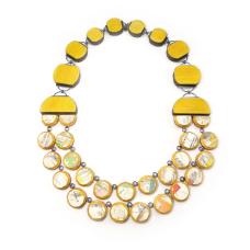 hand-cut macassar ebony and dyed maple laminate and upcycled skateboards with hand fabricated oxidized sterling silver components