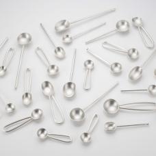 Variety of small spoons with various handles and bowl styles.