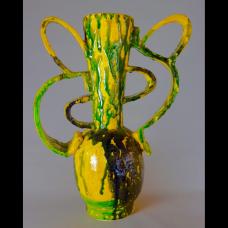 Handformed earthenware vessel sculpture created using a series of slumped forms whose parts are manipulated and assembled into one of a kind artworks multifired for the desired glaze effect and density