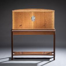 This cabinet features figured English brown oak and a stand of torrified ash.