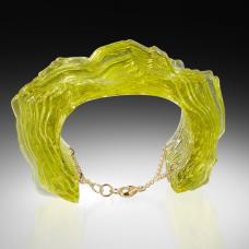 Digitally Designed  waterjet cut glass  coldworked  polished  fused and laminated together to form a 3 dimensional glass form. Gold Fill findings are embedded into the glass and attached to a gold fill chain for securing the piece on the arm.