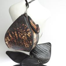 Blossom pattern zips into Pear; closed; recycled vinyl billboard with conveyor belting cutoffs strap. Shown open in leather. A transforming marvel suitable for entertaining your friends.