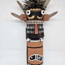 The Snake Kachina is a guard and protector  he is often seen during the summer kachina dances. The Kachina is carved out of aged cottonwood root  painted with natural earth mineral paints that I hand collect and process myself. Duck feathers  quail feathers and yucca from the yucca plant add to the finishing touches.