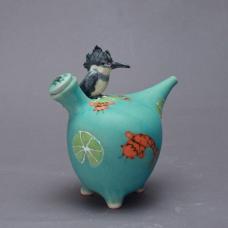 Wheel thrown porcelain  altered . Bird hand sculpted. Multiple glazes fired to cone 7 in electric kiln.