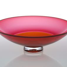 Ruby and apricot two color incalmo blown glass bowl with clear foot and trailed on lip wrap.
