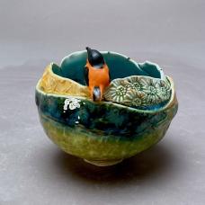 Wheel thrown porcelain  altered  bird hand sculpted. Layered glazes fired to cone 7 in electric kiln