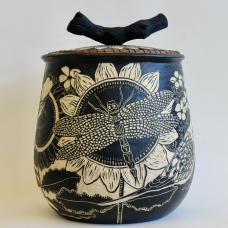 Handbuilt ceramic pot made from stoneware clay depicts flowers, birds and insects found in Maryland.