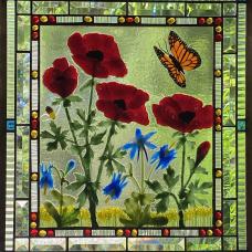 Fused glass botanicals using glass powders and frit  kiln fired for a dimensional surface.