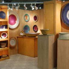 My booth is comprised of shelving  pedestals  and full wooden panels.