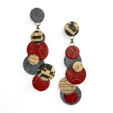 Polymer clay post earrings with a cascade of overlapping circles. Surface effects are letterforms transferred to the surface of the clay.