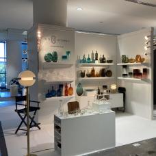 Booth with glass art on shelves