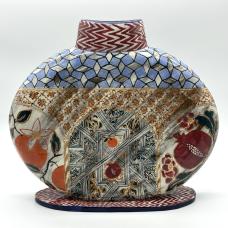 Hand built  and handpainted vase depicting  fruits famous in Spain and a stylized door in the center.