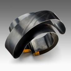 Bracelet: Sterling Silver and 18karat Gold Bimetal. Embossed  shapped and oxidized.