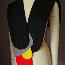 Zyra is designed for the modern wardrobe. This artisanal cotton shoulder wrap transforms craftsmanship into wearable art. Each piece is composed of layered cotton panels  shaped and stitched with precision to create an abstract play of colors that recalls the shimmer of fish scales. The design celebrates both creativity and comfort