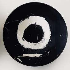 A single stroke circle painted with liquid porcelain. Very expressive and gestural.
