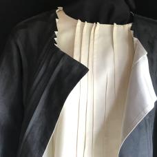Silk & wool reversible jacket shown over matching top. Linear surface design created by detailed folding and stitching.