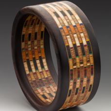 Bracelet has 12 different specie of wood and 300 pieces in it.