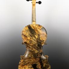 Violin's back made from the burl of a tree using a process that helps maintain it's unique appearance without sacrificing quality of sound