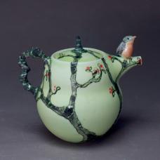 Wheel thrown porcelain  altered  bird hand sculpted. Multi layered original glazes  fired to cone 7 in electric kiln.