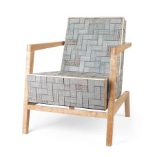 Easy chair with a cantilever frame construction made from maple wood.