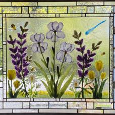 Dimensional fused glass botanicals created using glass powders and frit. Beveled and clear textured border enhances the botanical design.