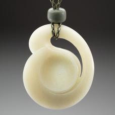 Jade necklace featuring a pendant I carved in Siberian jade  accented by Wyoming jade beads and a hand braided silk kumihimo cord.