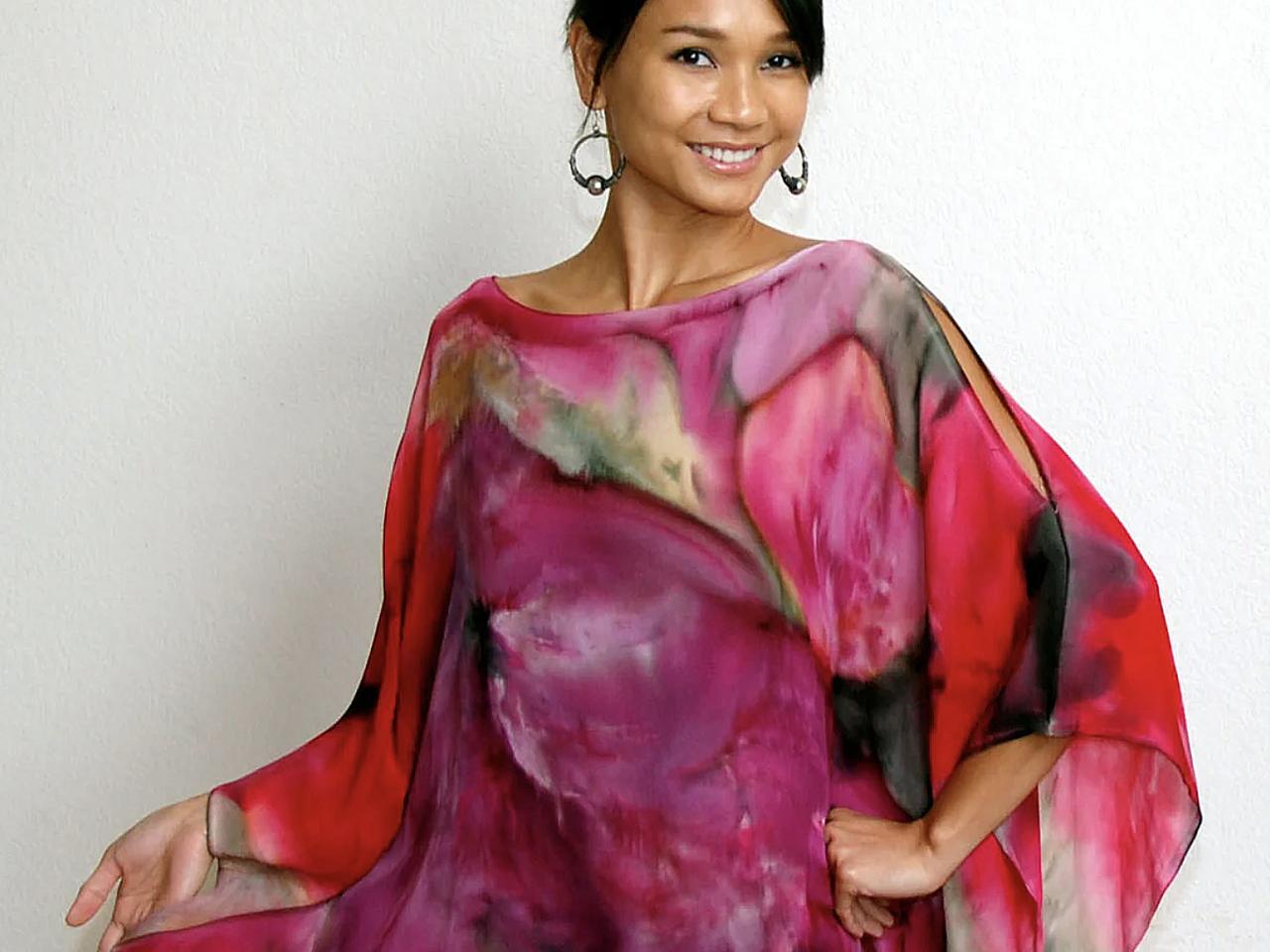 Woman wearing colorful flowing blouse